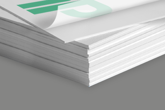 Close-up of 21pt thick postcard with soft-touch lamination showing luxurious texture and sturdy stock